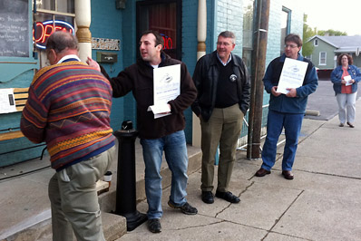 Guild members leaflet coffee on April 11, 2012